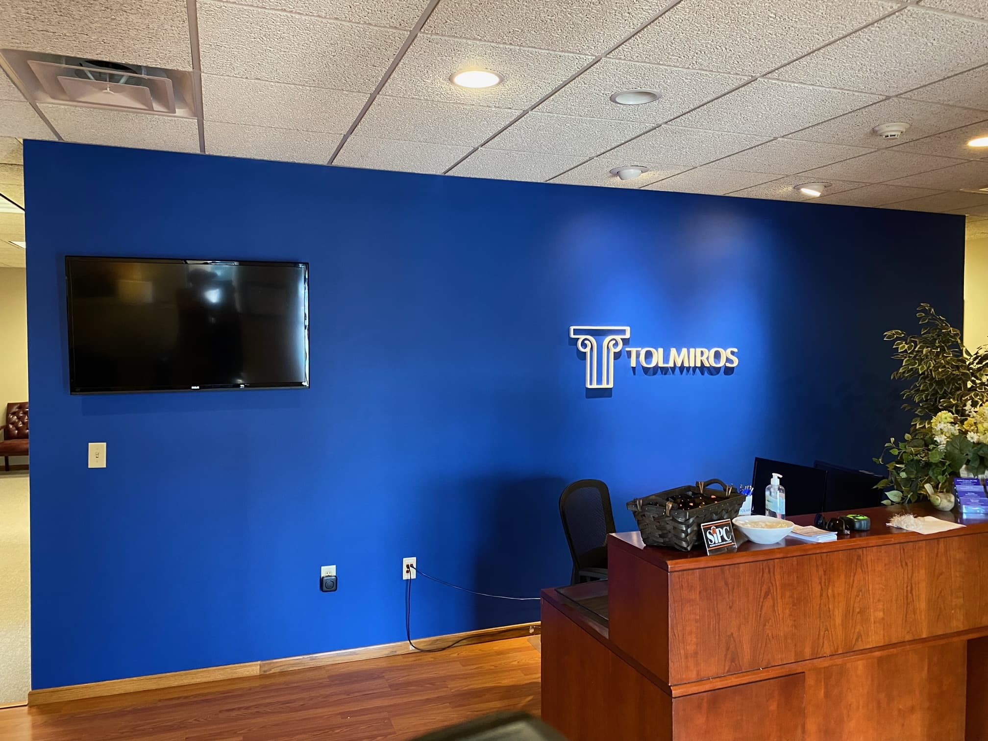 Lobby + Wall Logo Install — Tolmiros Financial
