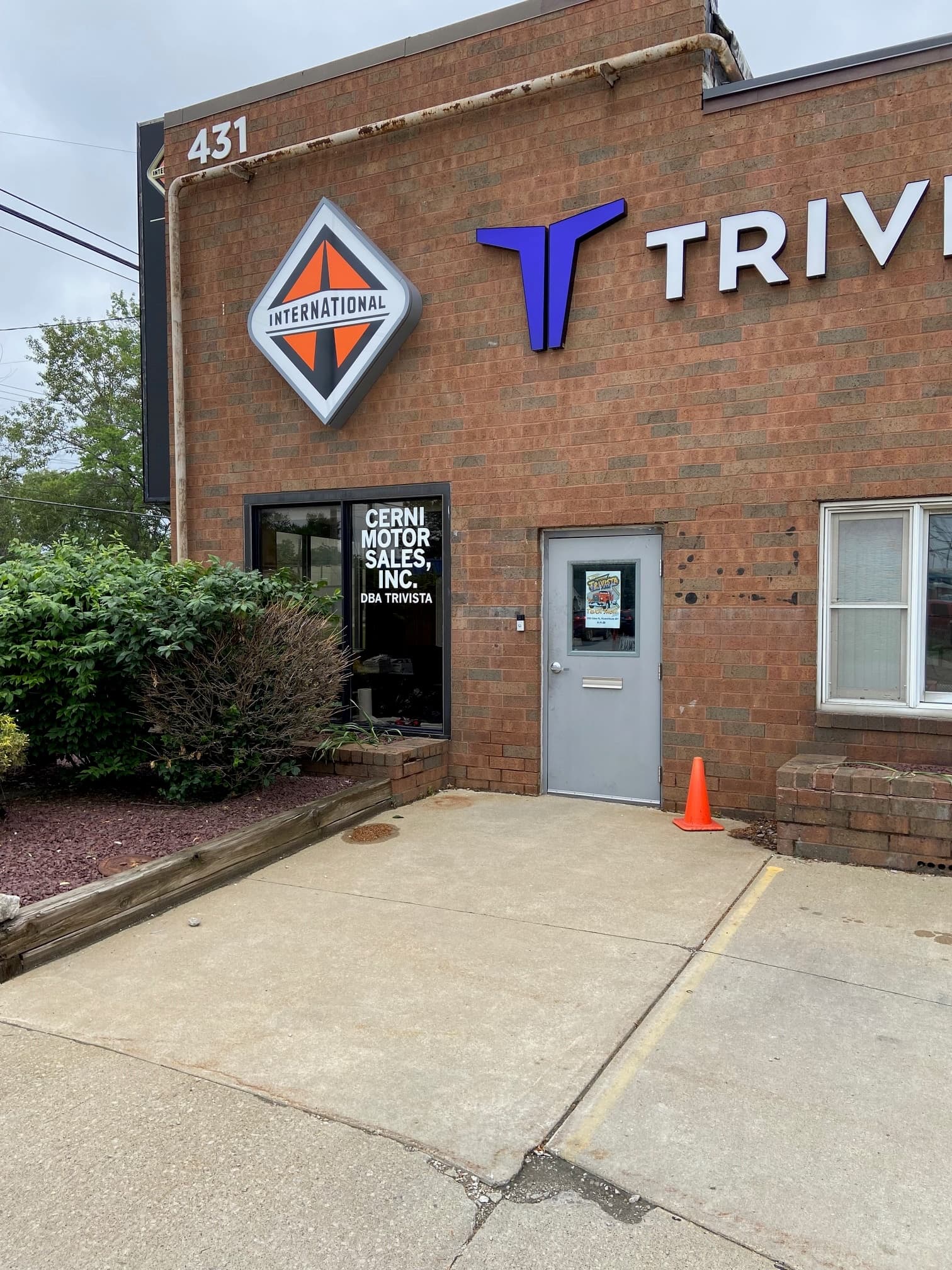 Cerni Motor Sales Inc DBA Trivista storefront with International diamond logo and dimensional Trivista mark