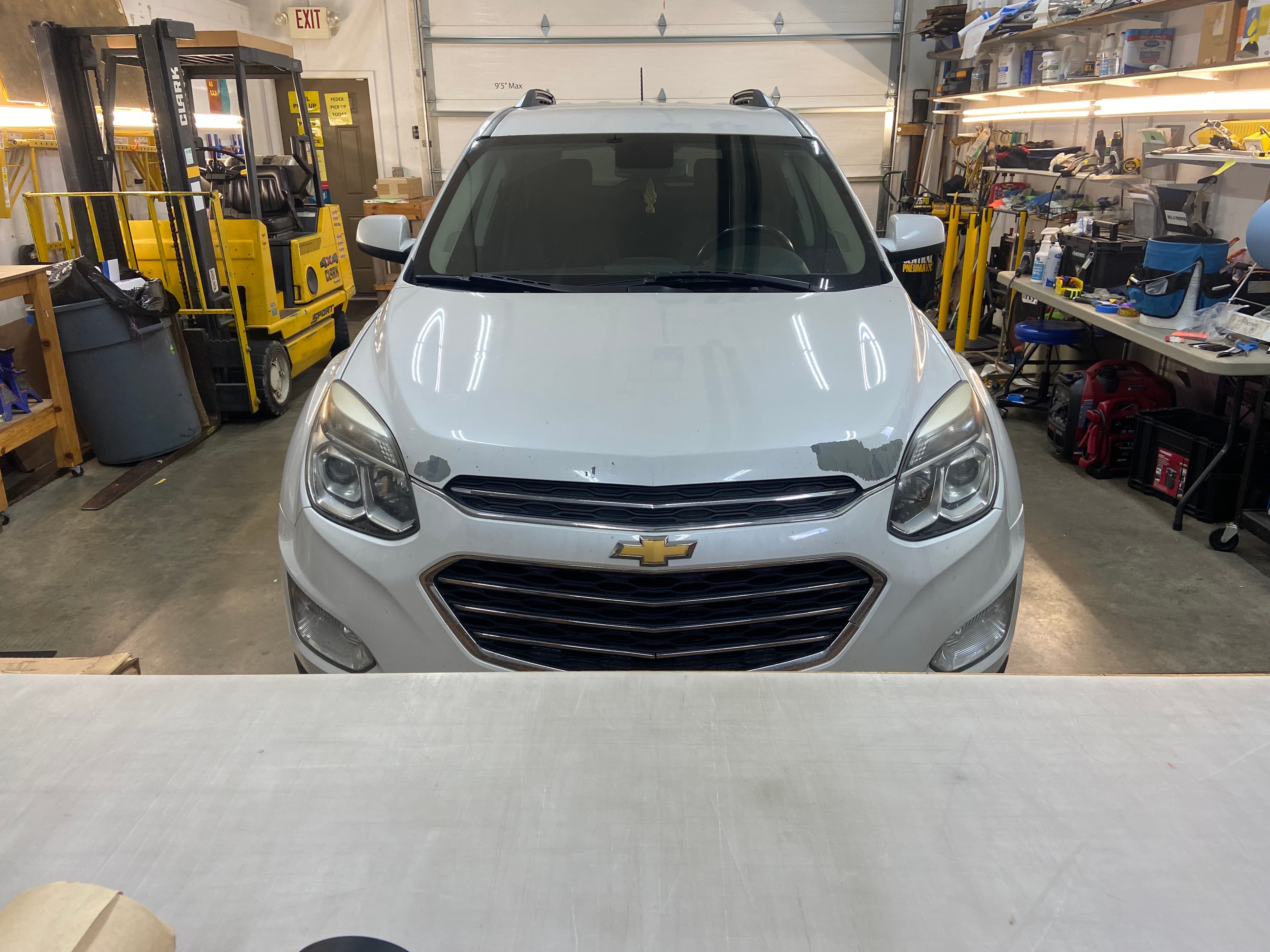 Chevy Equinox dealer-courtesy vehicle on the install bay