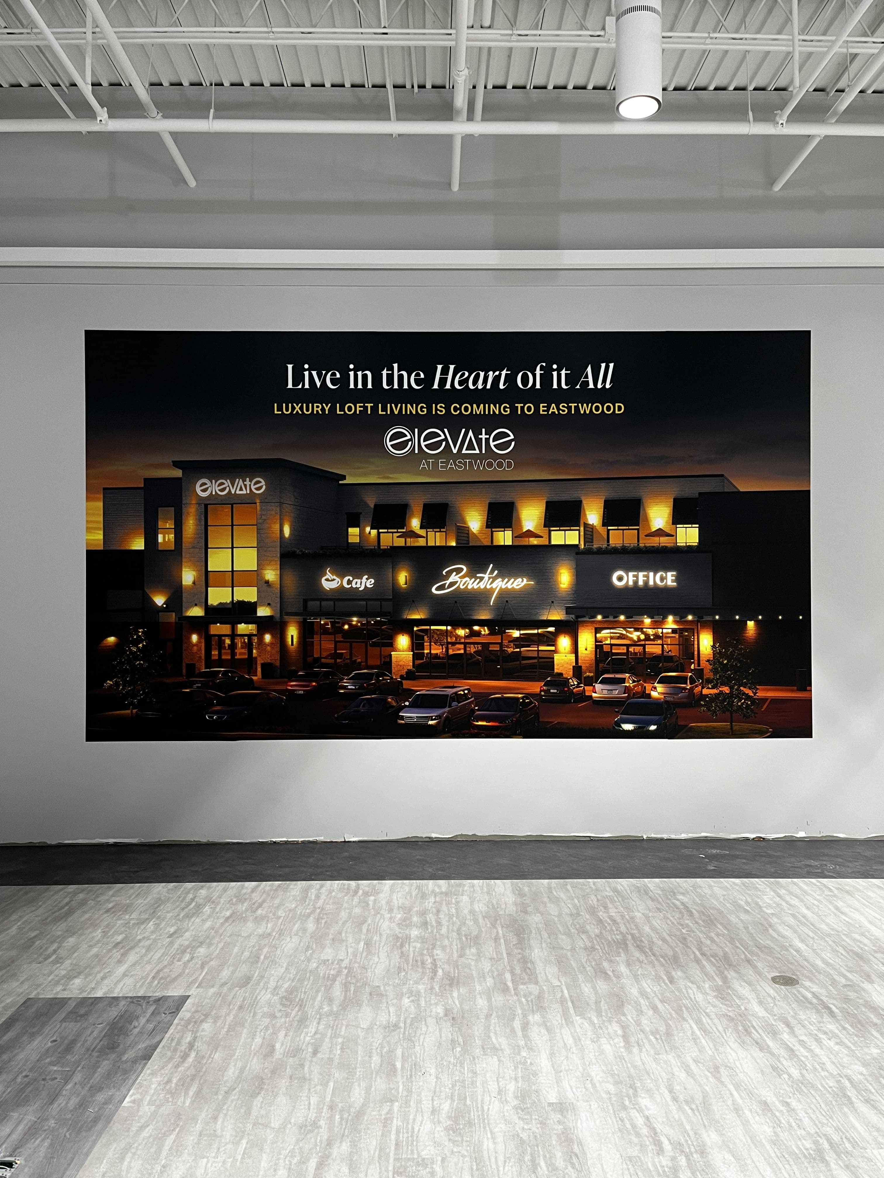 Elevate tenant wall graphic installation at Eastwood Mall