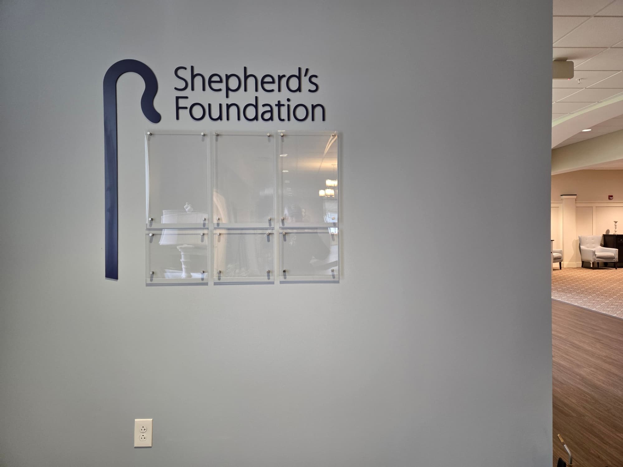 Shepherd's Foundation acrylic wall installation in the Girard campus lobby