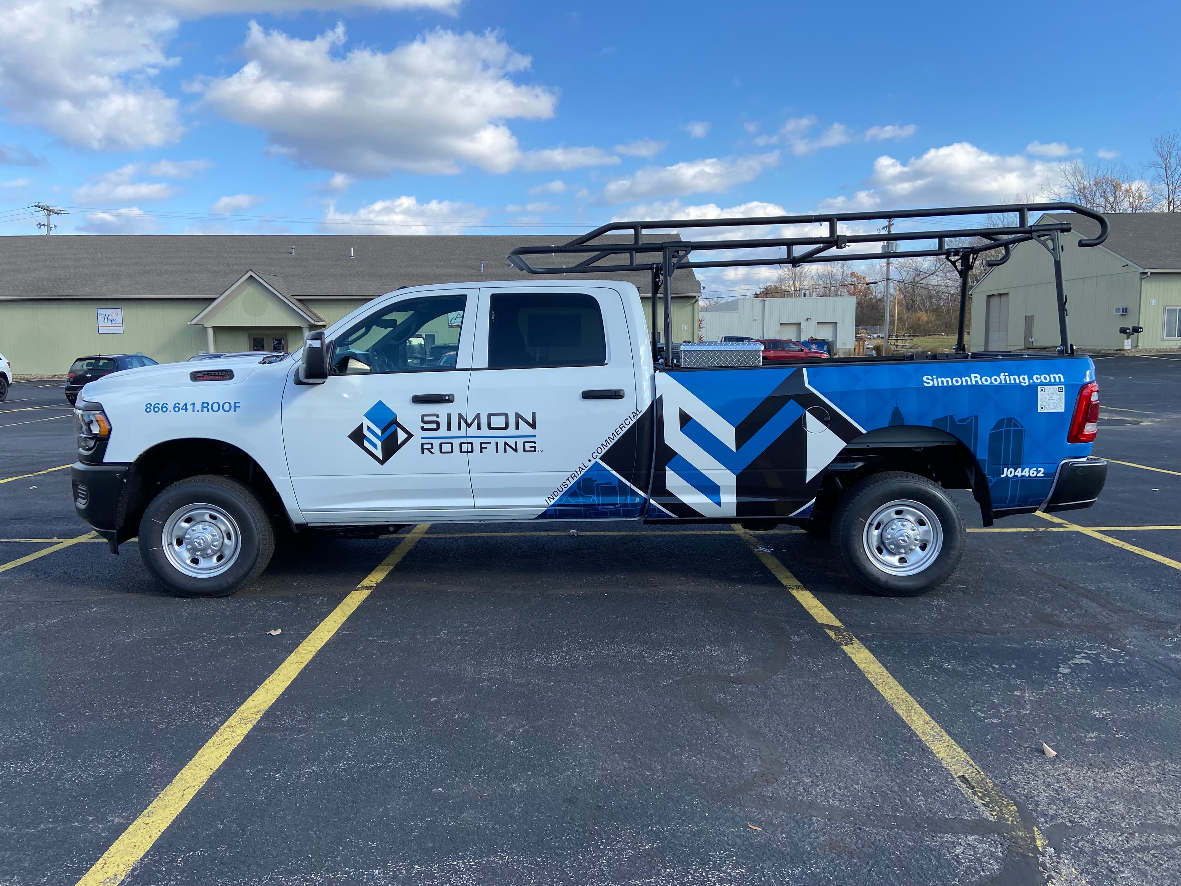 Simon Roofing Ram 2500 with full fleet wrap, side profile