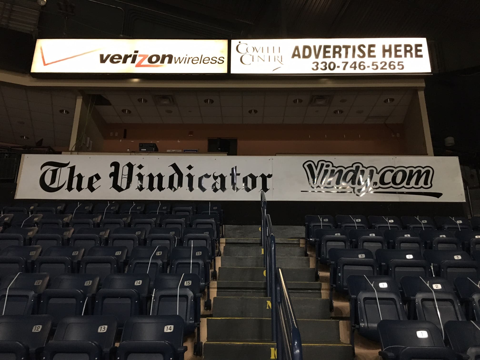 Arena bowl with The Vindicator sponsor signage and Verizon Wireless cabinet sign above seating